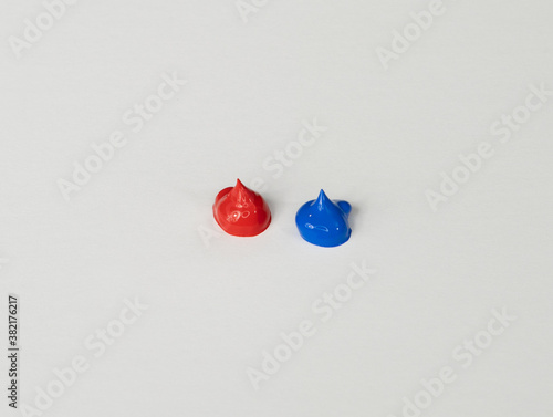 Acrylic Paint, Bright Blue and Red Dabs or Dollops, On White Background