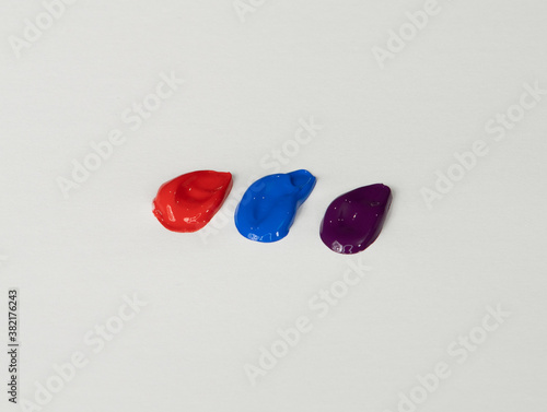 Acrylic Paint, Bright Blue, Red, Eggplant Purple Smears, On White Background