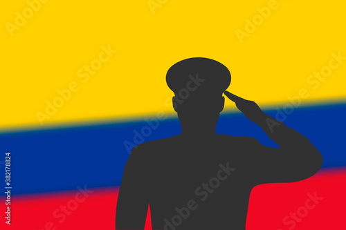 Solder silhouette on blur background with Colombia flag.