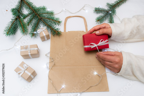 gift hand package white background red bag delivery christmas tree