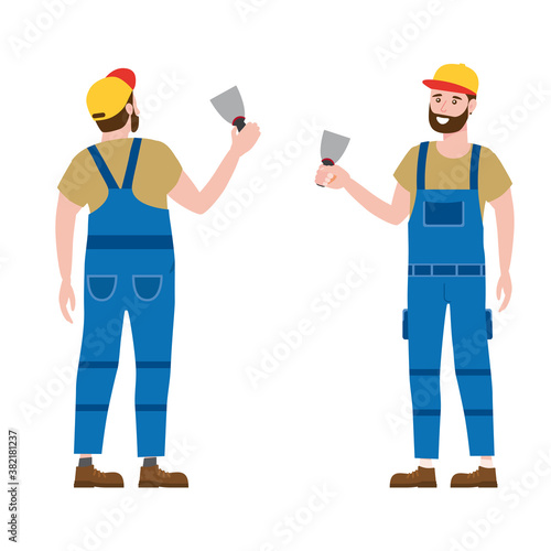 Construction worker with cordless screwdriver tool in workwear