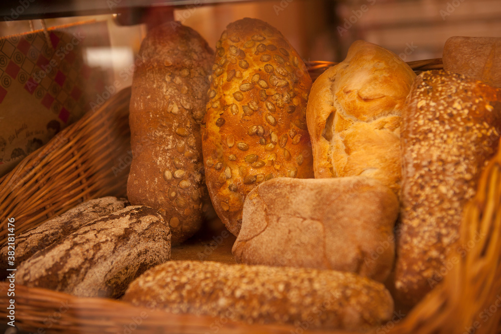 Delicious freshly baked bread on the display at local bakery store for sale