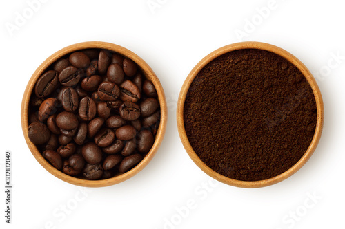 Coffee beans and coffee powder in wooden bowl on white background