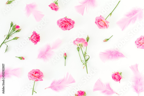 Wallpaper Mural Floral pattern of pink roses flowers and feathers on white background. Flat lay Torontodigital.ca