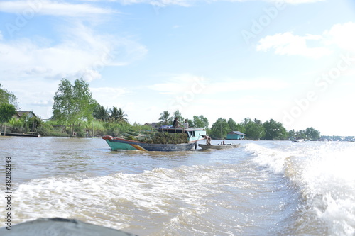 a fishing boat passing through Banyuasin waters, Indonesia photo