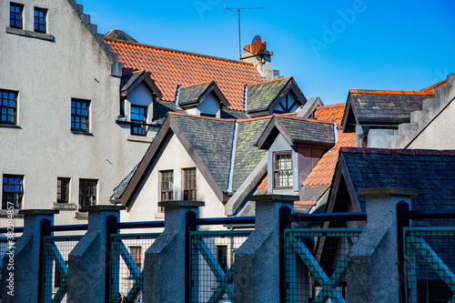 View of roofs and gabled roofs of various buildings from terrace with photo