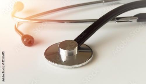 Close-up of a medical stethoscope on a white background with a glow effect, the concept of medicine