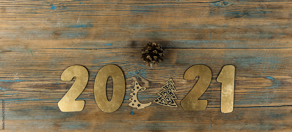 2021 happy new year gold number on wood table, space for display of product for promotion on christmas and new year holiday