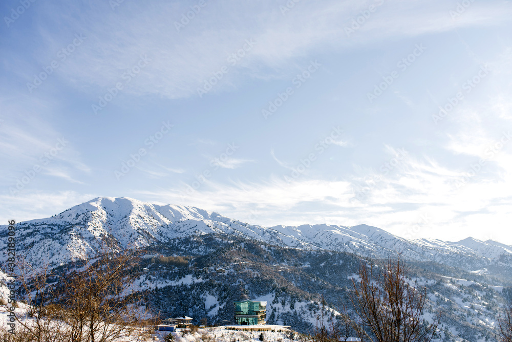Winter snow landscape near Beldersay resort in Uzbekistan, Tien Shan Mountains