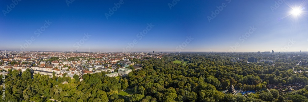 Panoramic aerial drone picture of Munich taken from English garden in the morning time