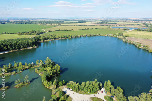 Aerial view of a natural swimming pool in the town of Surany in Slovakia