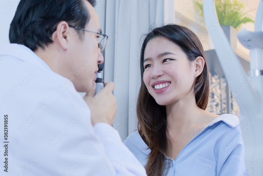 Portrait of asian woman doing eye test with Ophthalmologist Portrait of asian woman doing eye test with Ophthalmologist