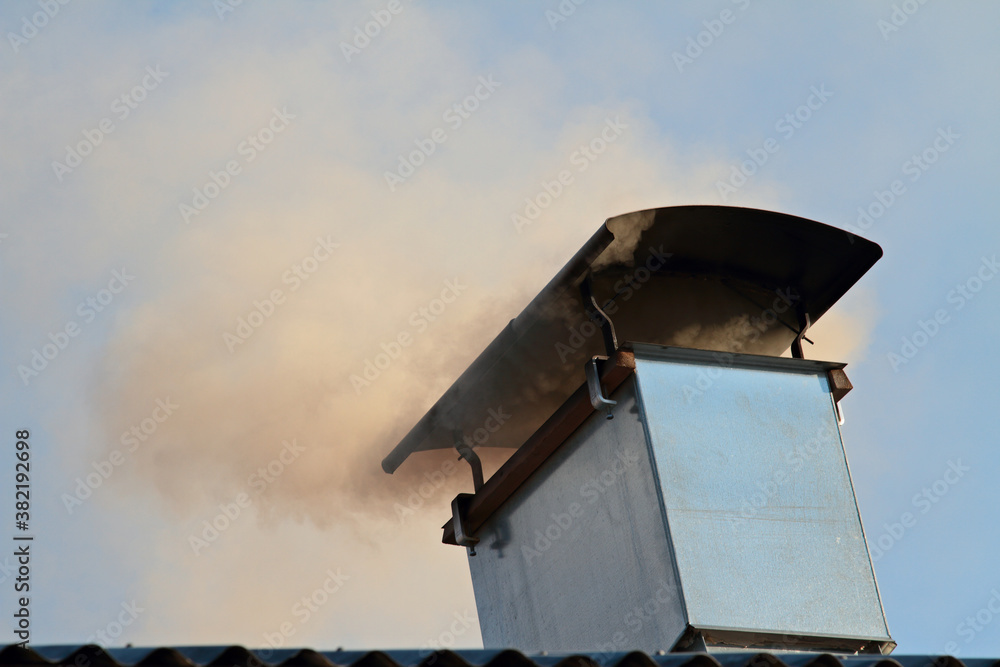 Smoke puffing out of a chimney