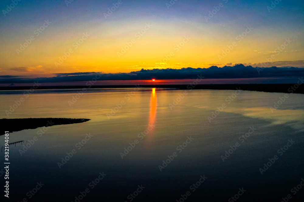 Sunrise over Perdido Bay on a calm morning Sunrise over Perdido Bay on a calm morning
