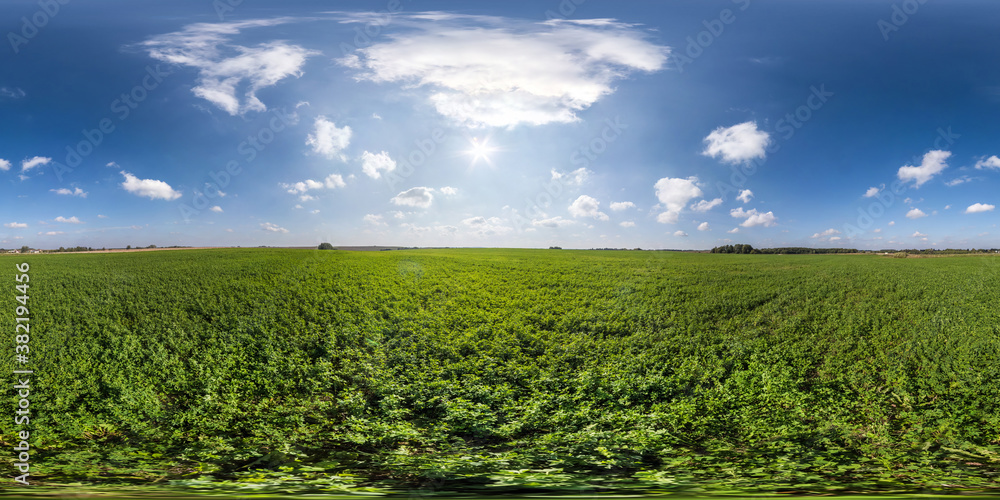 Fototapeta premium full seamless spherical hdri panorama 360 degrees angle view on among green fields in summer day with awesome clouds in equirectangular projection, ready for VR AR virtual reality content