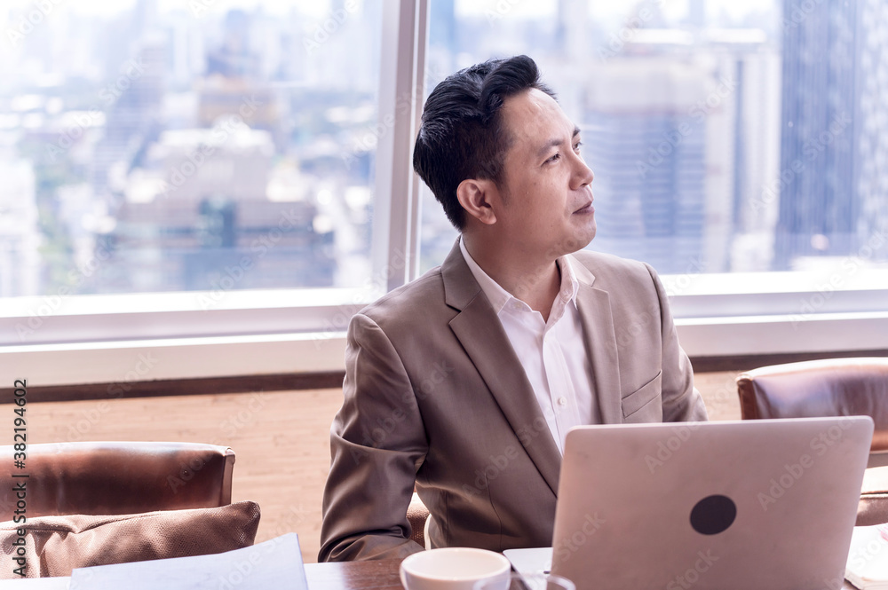 Portrait of happy businessman having meeting to success deal business at skyscraper office with cityscape business zone background Portrait of happy businessman having meeting to success deal business at skyscraper office with cityscape business zone background