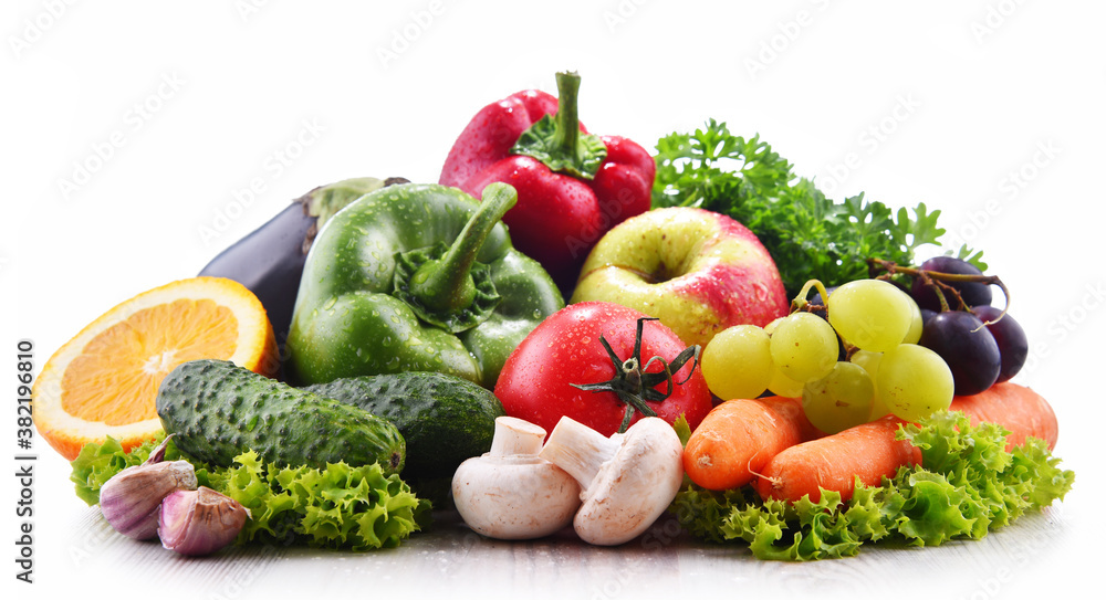 Composition with fresh vegetables and fruits isolated on white Composition with fresh vegetables and fruits isolated on white