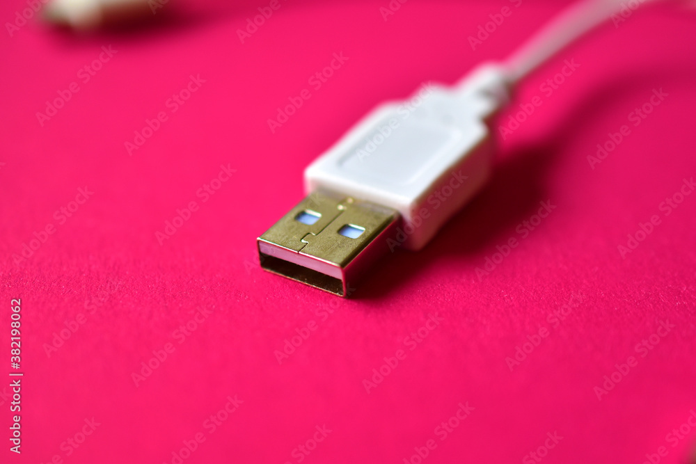Two white USB connectors on a red background Two white USB connectors on a red background