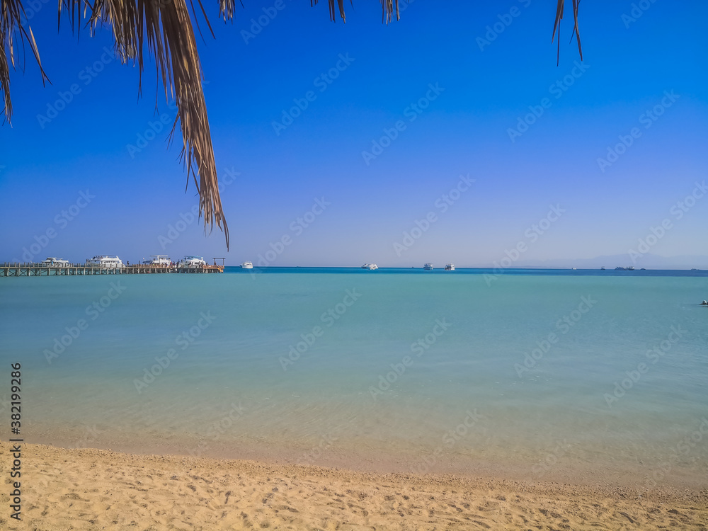 Crystal clear azure water - Orange Bay Beach with white beach - paradise coastline of Giftun island, Mahmya, Hurghada, Red Sea, Egypt