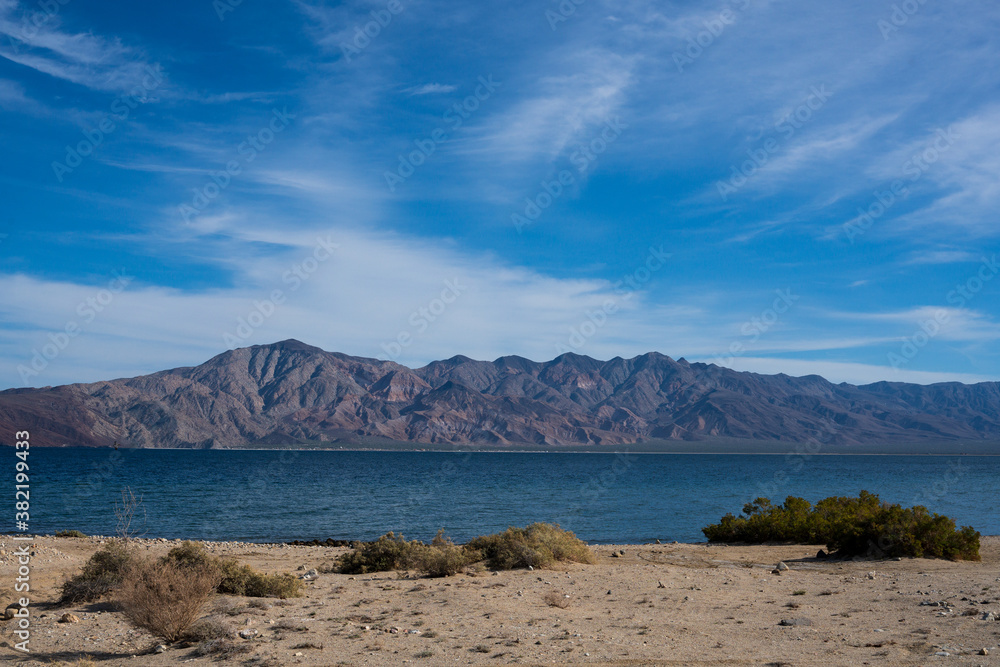 Breathtaking landscape with mountain layers and vibrant blue sky on the Gulf of California in Bahia de los Angeles in Baja California. Travel destination.