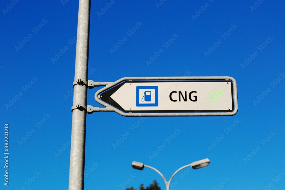 Sign shows direction gas station with CNG. Traffic sign indicating a