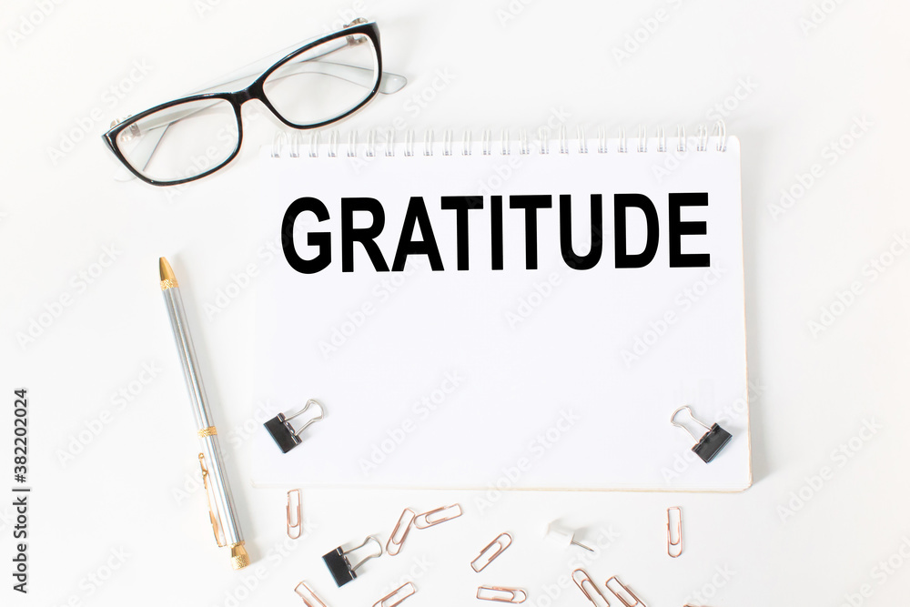 Notepad with inscriptions gratitude on a white background. business concept. Notepad with inscriptions gratitude on a white background. business concept.