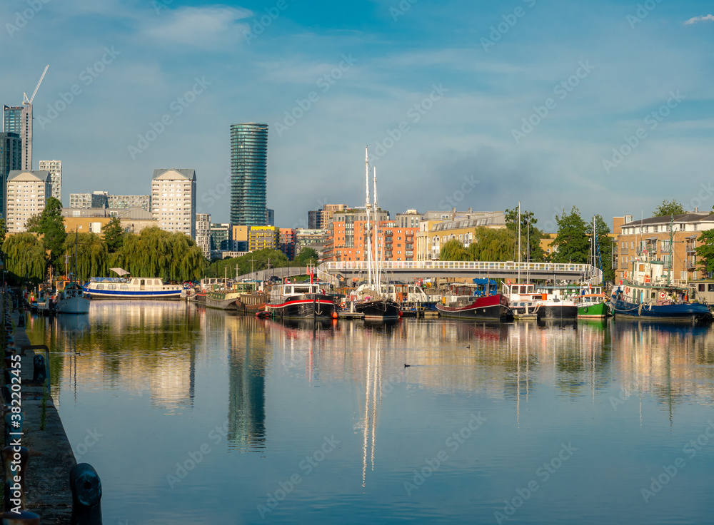Surrey Docks harbour in the city of London reflected in the Thames river