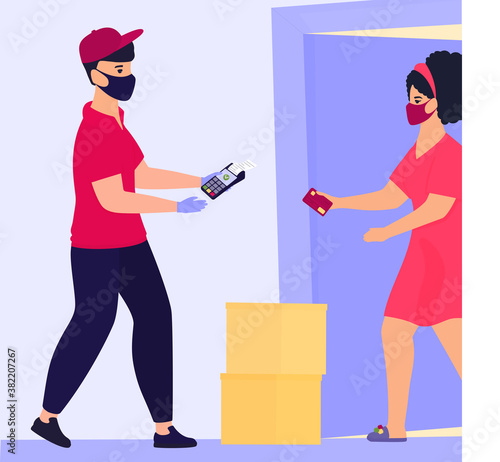 COVID-19. Coronavirus. Safe contactless delivery. Courier in a protective medical mask brought the parcel to the door. Housewife pay by credit card via pos terminal. Quarantine. Self isolation