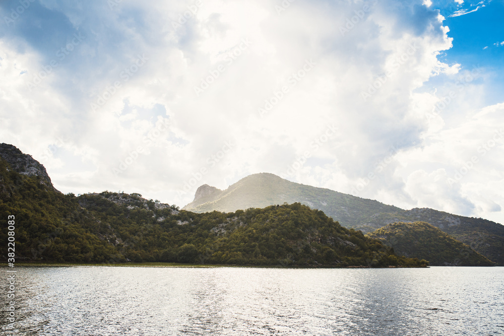 Lake and mountains in an ecological reserve - nature park with fishing