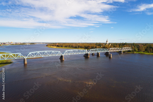 Aerial view of the railroad bridge over Tornio river seen from Haparanda at the Swedish-Finno border.