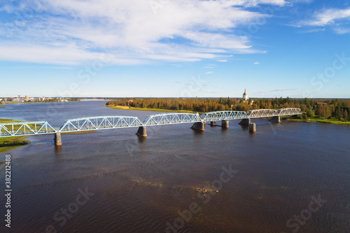 Aerial view of the railroad bridge over Tornio river seen from Haparanda at the Swedish-Finno border.