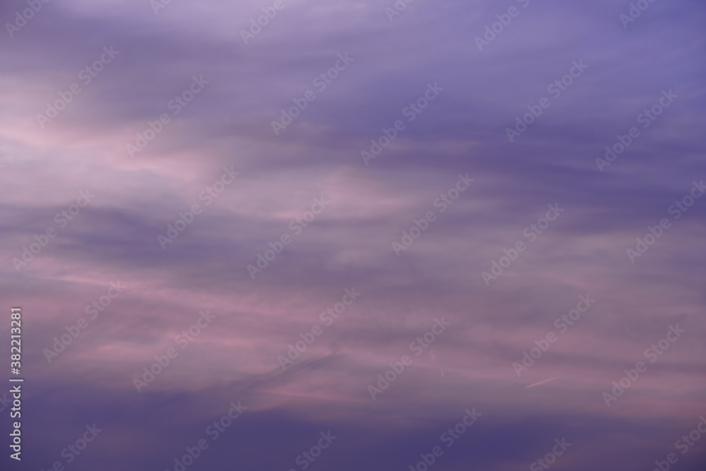 Pink-violet evening sky with thin clouds