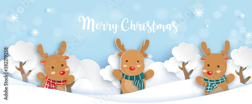 Christmas banner with a reindeer in paper cut and craft style.