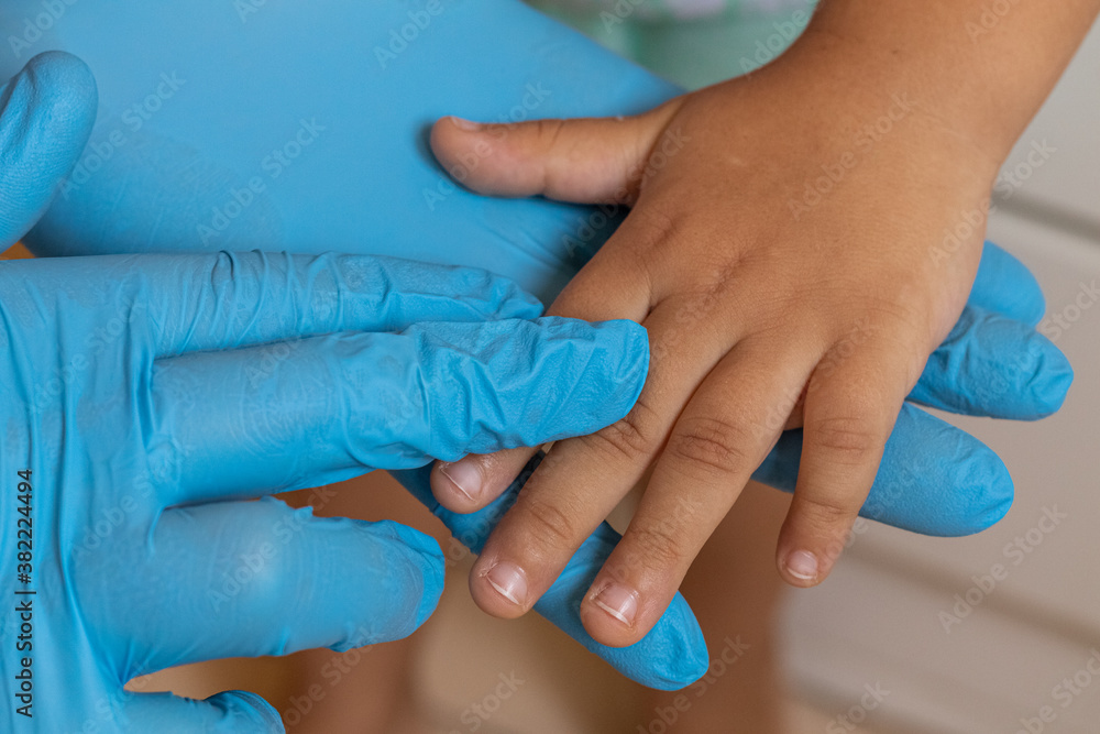 Fototapeta premium doctor taking care of child - taking hand