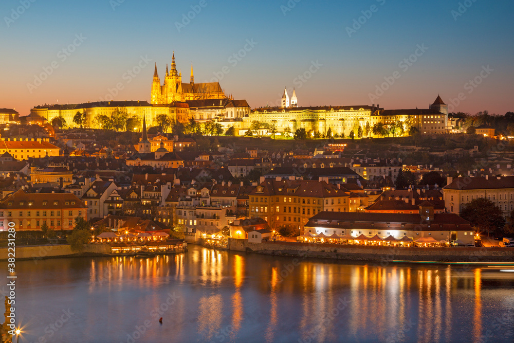 Prague - The Castle and Cathedral withe the Vltava river at dusk.