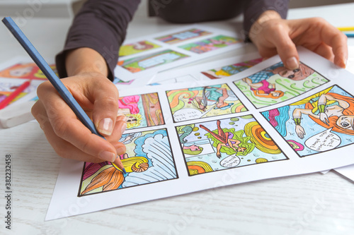 The woman is drawing a storyboard. Illustrator draws color storytelling.