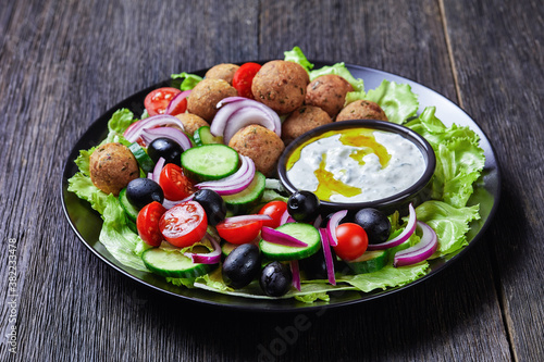 Platter of falafels with vegetables with tzatziki