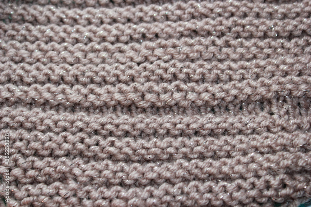 Background of gray knitted woolen yarn