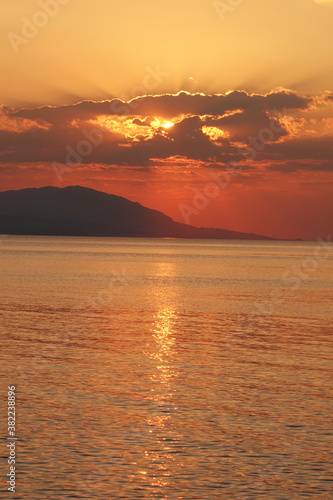 Beautiful sunset over Aegean sea as seen from Santorini island  Cyclades  Greece