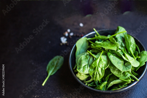spinach green leaves healthy salad organic ingredients vitamins cook a snack meal on the table tasty serving size portion top view copy space for text food background rustic