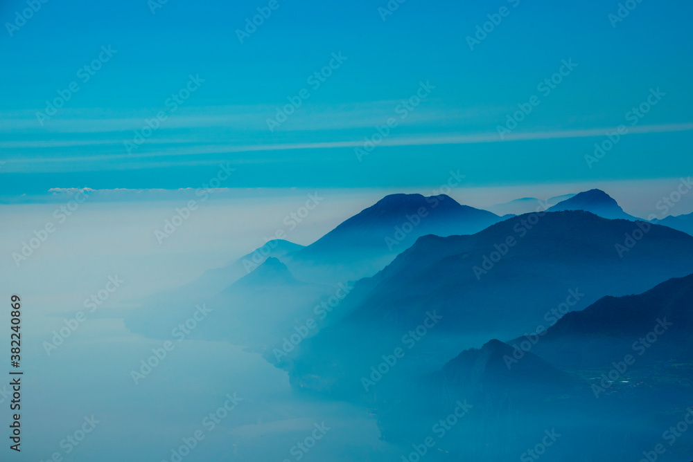 fog between lake and mountains