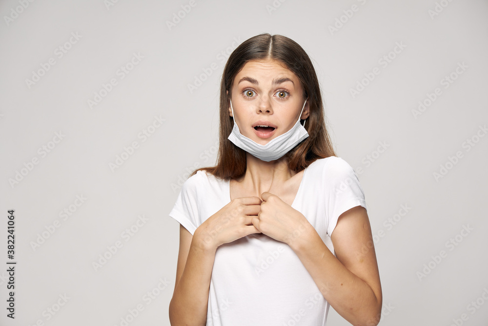 woman in medical mask surprised look white t-shirt cropped view woman in medical mask surprised look white t-shirt cropped view