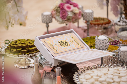 Tela Close up view of Persian (Iranian) wedding table set with Holy Book of Quran, mi