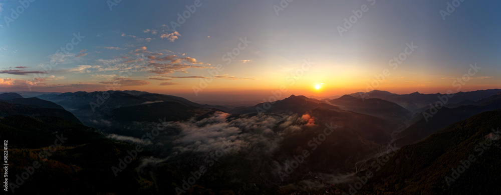 Landscape from Rhodope mountains in Bulgaria during sunset or sunrise. Small chapel and monastery near Borovo, Rhodopes
