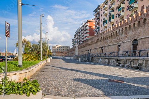 Waterfront Calata della Rocca with the protective wall in Civitavecchia, Italy