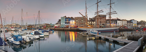 Dusk over Sutton Harbour and the Barbican, the historic and tourist heart of the city of Plymouth, Devon, England, United Kingdom
