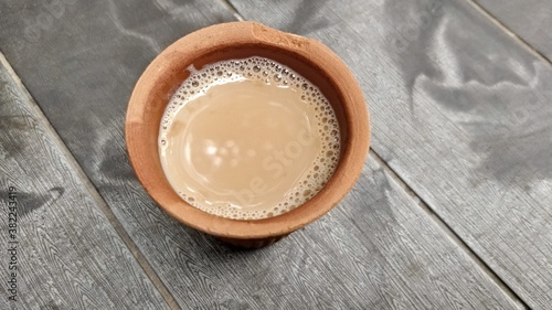A kulhar or kulhad cup  traditional handle-less clay cup  from North India filled with hot Indian tea