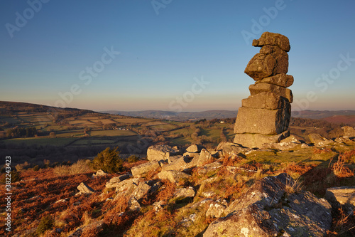 A natural granite outcrop seen in low winter sunlight, Bowerman's Nose, Dartmoor National Park, Devon, England, United Kingdom photo