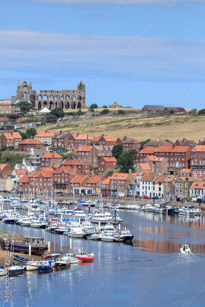 The harbour and the ruined abbey on the hill behind, Whitby, Yorkshire The harbour and the ruined abbey on the hill behind, Whitby, Yorkshire