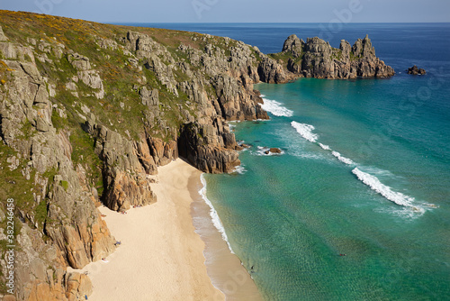 Iconic view from Treen cliffs, across the sands of Pedn Vaunder to the Logan Rock headland, near Penzance, Cornwall photo